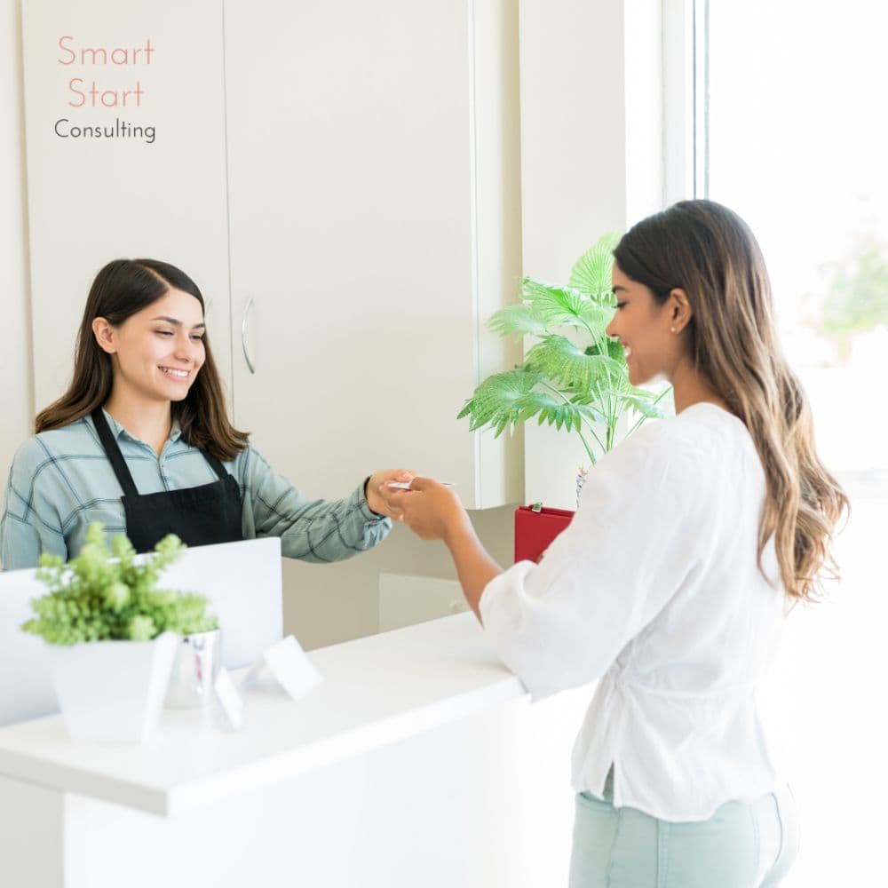 Customer paying at salon counter